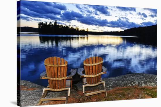 Wooden Chairs at Sunset on Lake Shore-elenathewise-Stretched Canvas