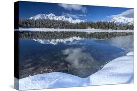 Wooden Chalet Surrounded by Snowy Peaks and Woods Reflected in Lake Palu, Valtellina, Italy-Roberto Moiola-Stretched Canvas