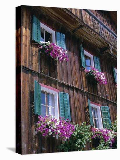 Wooden Chalet with Flowers, Hallstatt, Austria, Europe-Jean Brooks-Stretched Canvas