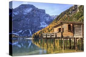 Wooden Hut and Colourful Woods Reflected in Lake Braies, Italy-Roberto Moiola-Stretched Canvas