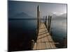 Wooden Jetty and Volcanoes in the Distance, Lago Atitlan (Lake Atitlan), Guatemala, Central America-Colin Brynn-Mounted Photographic Print