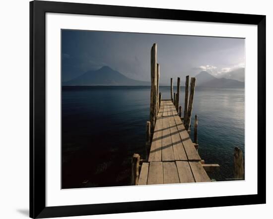Wooden Jetty and Volcanoes in the Distance, Lago Atitlan (Lake Atitlan), Guatemala, Central America-Colin Brynn-Framed Photographic Print