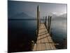 Wooden Jetty and Volcanoes in the Distance, Lago Atitlan (Lake Atitlan), Guatemala, Central America-Colin Brynn-Mounted Photographic Print