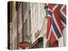 Wooden Merchants Premises and Norwegian Flag, Bryggen Old Harbour Side, Bergen, Norway, Scandinavia-James Emmerson-Stretched Canvas