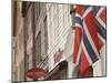 Wooden Merchants Premises and Norwegian Flag, Bryggen Old Harbour Side, Bergen, Norway, Scandinavia-James Emmerson-Mounted Premium Photographic Print