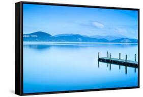 Wooden Pier or Jetty and on A Blue Lake Sunset and Sky Reflection on Water. Versilia Tuscany, Italy-stevanzz-Framed Stretched Canvas