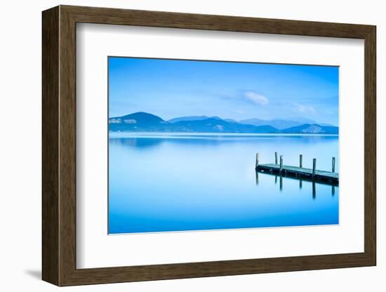 Wooden Pier or Jetty and on A Blue Lake Sunset and Sky Reflection on Water. Versilia Tuscany, Italy-stevanzz-Framed Photographic Print