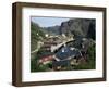 Wooden Red Houses on Stilts Over Water at the Fishing Village of Nusfjord, Lofoten Islands, Norway-Tony Waltham-Framed Photographic Print