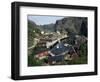 Wooden Red Houses on Stilts Over Water at the Fishing Village of Nusfjord, Lofoten Islands, Norway-Tony Waltham-Framed Photographic Print