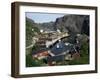 Wooden Red Houses on Stilts Over Water at the Fishing Village of Nusfjord, Lofoten Islands, Norway-Tony Waltham-Framed Photographic Print