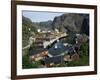 Wooden Red Houses on Stilts Over Water at the Fishing Village of Nusfjord, Lofoten Islands, Norway-Tony Waltham-Framed Photographic Print