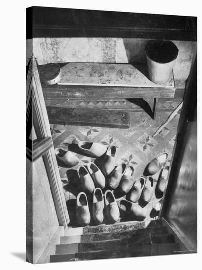 Wooden Shoes in a Hallway at the Bottom of the Stairs-George Rodger-Stretched Canvas