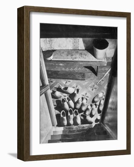 Wooden Shoes in a Hallway at the Bottom of the Stairs-George Rodger-Framed Photographic Print