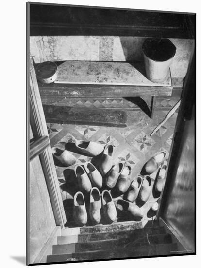 Wooden Shoes in a Hallway at the Bottom of the Stairs-George Rodger-Mounted Photographic Print