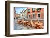 Wooden Tables on Narrow Street among Typical Colorful Houses and Small Bridge in Venice, Italy.-rglinsky-Framed Photographic Print