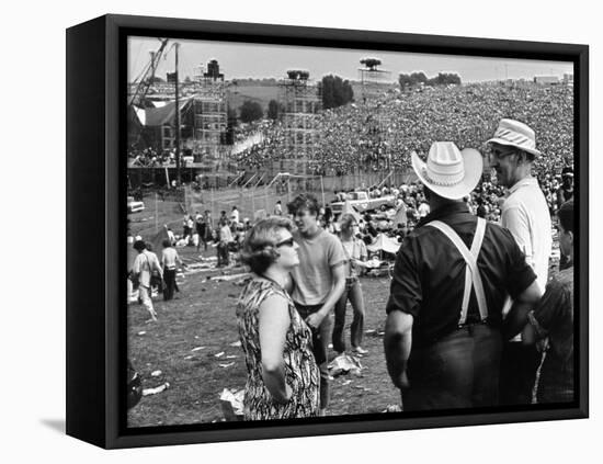 Woodstock, Farmer Max Yasgur Looks On As His Grounds Are Used For Woodstock Festival, 1970-null-Framed Stretched Canvas