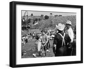 Woodstock, Farmer Max Yasgur Looks On As His Grounds Are Used For Woodstock Festival, 1970-null-Framed Photo