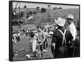 Woodstock, Farmer Max Yasgur Looks On As His Grounds Are Used For Woodstock Festival, 1970-null-Framed Photo