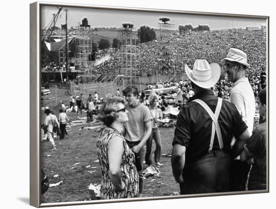 Woodstock, Farmer Max Yasgur Looks On As His Grounds Are Used For Woodstock Festival, 1970-null-Framed Photo