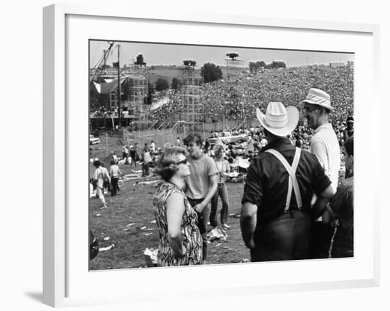 Woodstock, Farmer Max Yasgur Looks On As His Grounds Are Used For Woodstock Festival, 1970-null-Framed Photo