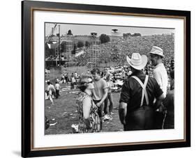 Woodstock, Farmer Max Yasgur Looks On As His Grounds Are Used For Woodstock Festival, 1970-null-Framed Photo