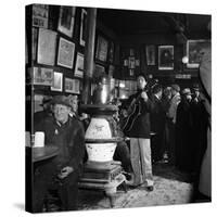 Woody Guthrie Playing in McSorley's Pub-Eric Schaal-Stretched Canvas