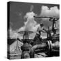 Worker Opening up a Pipeline to Let the Oil Flow-Thomas D^ Mcavoy-Stretched Canvas