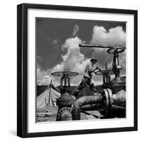 Worker Opening up a Pipeline to Let the Oil Flow-Thomas D^ Mcavoy-Framed Premium Photographic Print