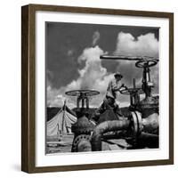 Worker Opening up a Pipeline to Let the Oil Flow-Thomas D^ Mcavoy-Framed Photographic Print