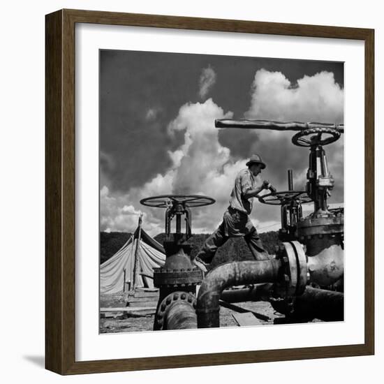Worker Opening up a Pipeline to Let the Oil Flow-Thomas D^ Mcavoy-Framed Photographic Print