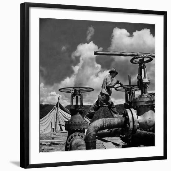 Worker Opening up a Pipeline to Let the Oil Flow-Thomas D^ Mcavoy-Framed Photographic Print