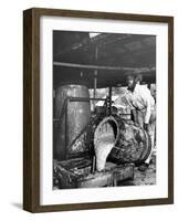 Worker Pouring Gum from Pine Trees into a Still During Turpentine Production-Hansel Mieth-Framed Photographic Print