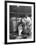 Worker Pouring Gum from Pine Trees into a Still During Turpentine Production-Hansel Mieth-Framed Photographic Print