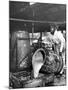 Worker Pouring Gum from Pine Trees into a Still During Turpentine Production-Hansel Mieth-Mounted Photographic Print