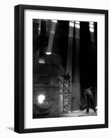 Worker Shoveling Limestone Into an Electric Blast Furnace at Republic Steel Mill-Margaret Bourke-White-Framed Photographic Print