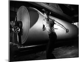 Worker Tearing Off a Sample from a Roll of Paper to Test Its Quality-Margaret Bourke-White-Mounted Photographic Print