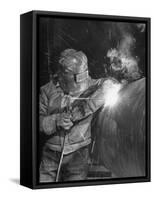 Worker Welding Pipe Used in Natural Gas Pipeline at World's Biggest Coal Fueled Generating Plant-Margaret Bourke-White-Framed Stretched Canvas