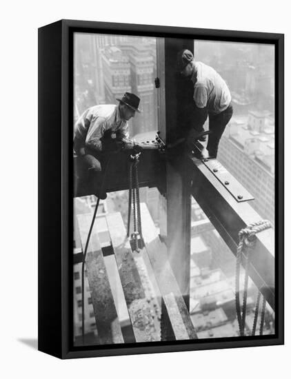 Workers balancing on steel beam above streets during construction of the Manhattan Company Building-Arthur Gerlach-Framed Stretched Canvas