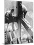 Workers balancing on steel beam above streets during construction of the Manhattan Company Building-Arthur Gerlach-Mounted Photographic Print