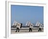 Workers Carry Beach Chairs Along the Beach of St. Peter-Ording at the North Sea, Northern Germany-null-Framed Photographic Print