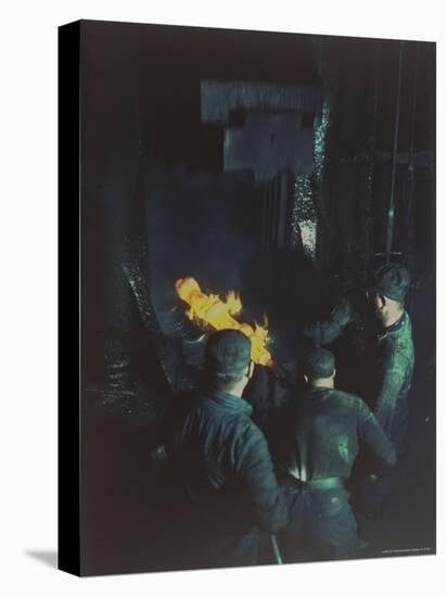 Workers Forging Molten Metal with 16,000 lb Drop Forging Hammer at Wyman-Gordon Co-Andreas Feininger-Stretched Canvas
