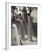 Workers Guiding Granary Filling Spouts as They Pour Tons of Wheat into River Barge for Shipment-Margaret Bourke-White-Framed Photographic Print