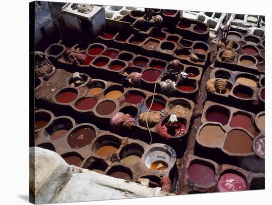 Workers in the Dyeing Pits of a Leather Tannery, Fez, Morocco-Susanna Wyatt-Stretched Canvas