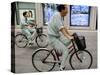 Workers Pedal Bicycles Past a Securities Firm in Tokyo-null-Stretched Canvas