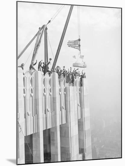 Workers Placing Last Stone on RCA Building-null-Mounted Photographic Print