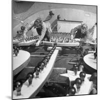 Workers Restoring Lightbulbs in a Sign-William Sumits-Mounted Photographic Print