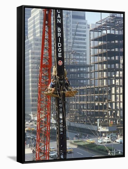 Workers Service Crane Across Street from National Bank Building under Construction on Park Ave-Dmitri Kessel-Framed Stretched Canvas