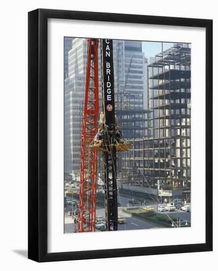 Workers Service Crane Across Street from National Bank Building under Construction on Park Ave-Dmitri Kessel-Framed Photographic Print