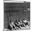 Workers Sitting Against Wall During Lunch Break, at Vega Aircraft Plant, During WWII: Burbank, Ca-Charles Fenno Jacobs-Mounted Photographic Print