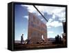 Workers Watching as Steel Beam is Raised High Above During Sub Assembling of Ship at Shipyard-Hansel Mieth-Framed Stretched Canvas